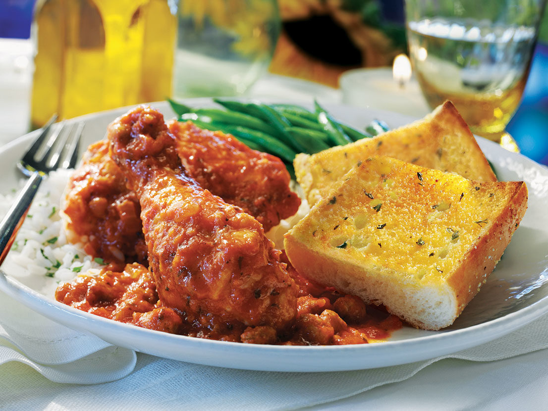 Serving of Italian Chicken with Garlic Bread made with Prego® sauce