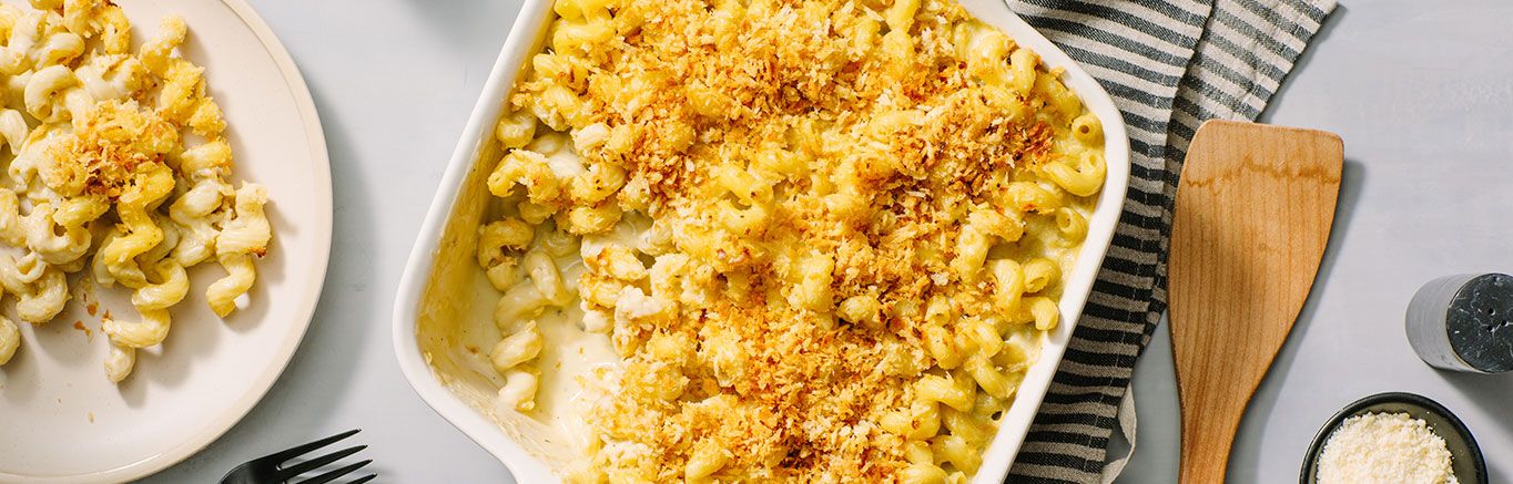 An image of prepared Pesto Mac & Cheese made with cavatappi pasta, Prego® Creamy Parmesan Pesto Sauce, Parmesan and white Cheddar cheese.